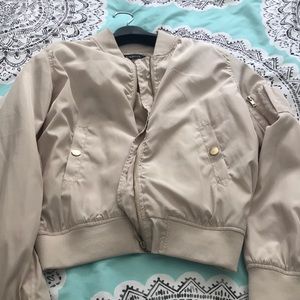 Cream colored bomber jacket